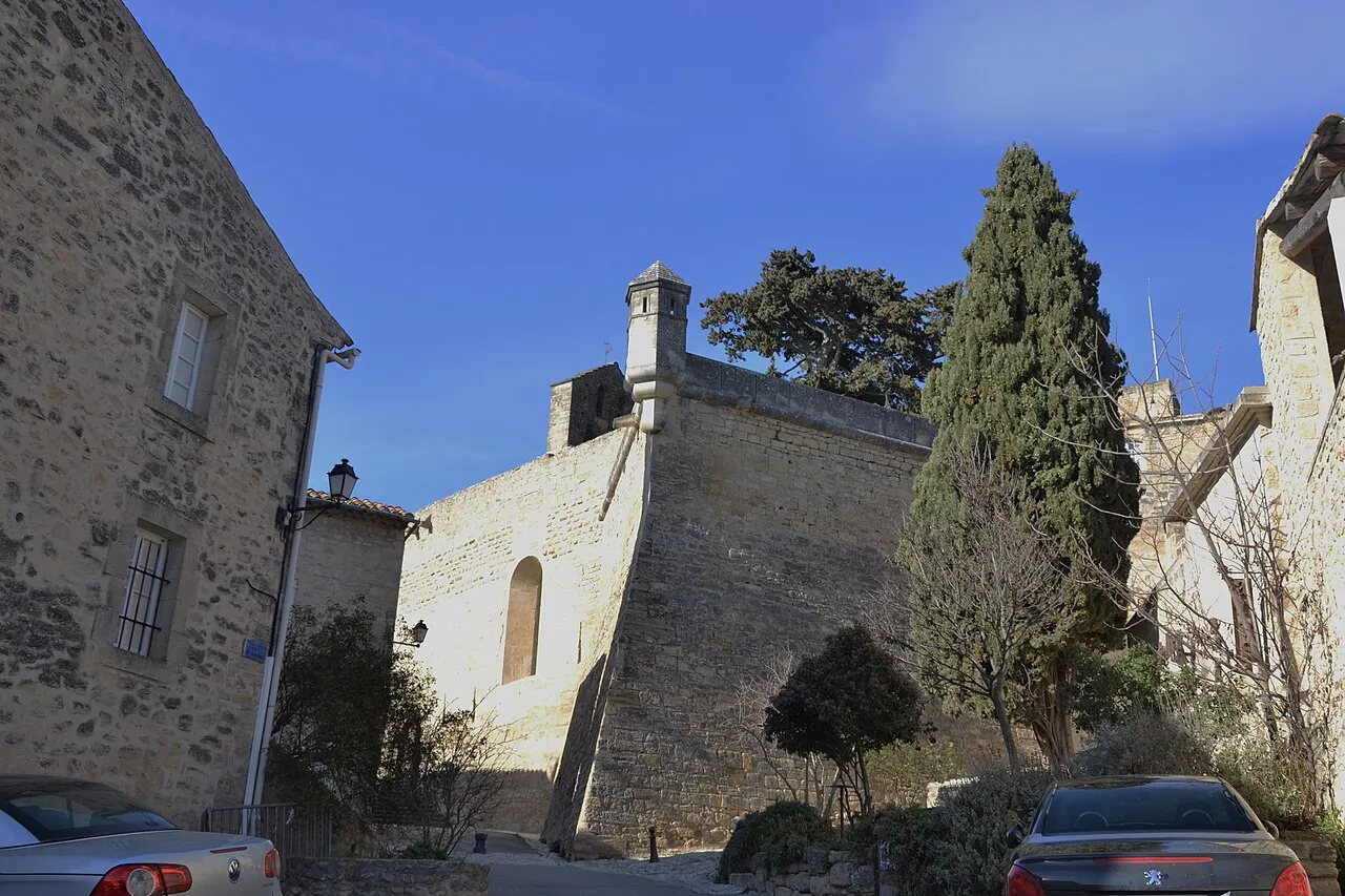 Stone ramparts and a watchtower beside the Château d’Ansouis