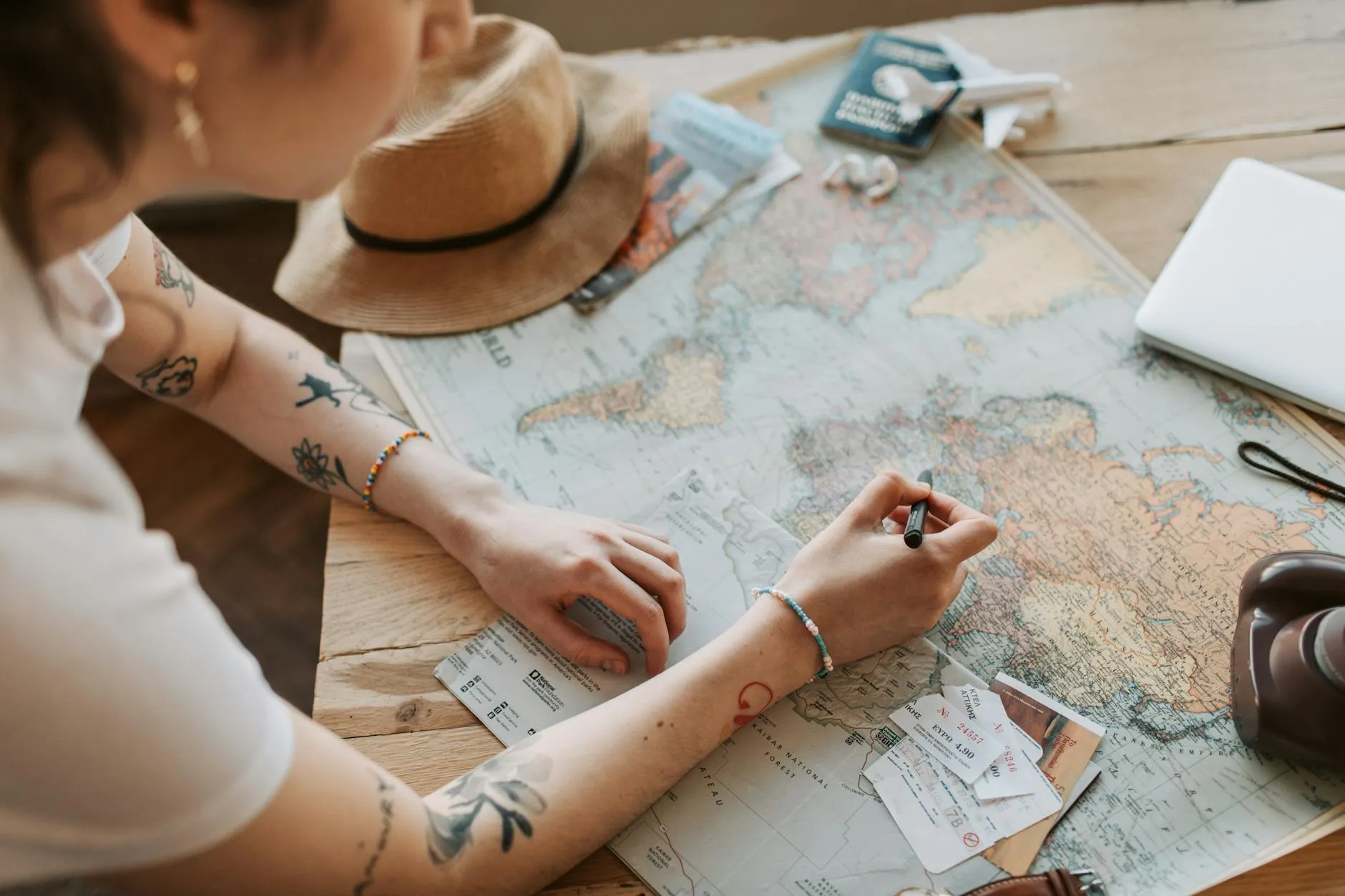 Planning a trip with a map and laptop